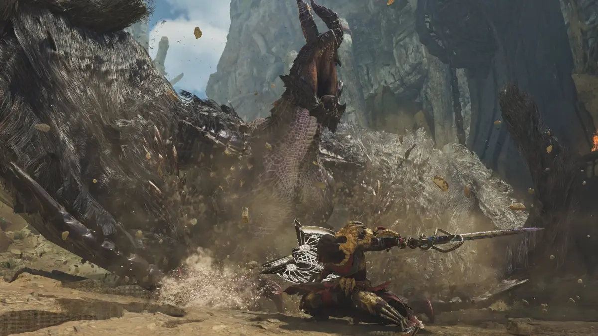 巨大なモンスターが砂塵を巻き上げながら猛威を振るい、ハンターがその攻撃に立ち向かう