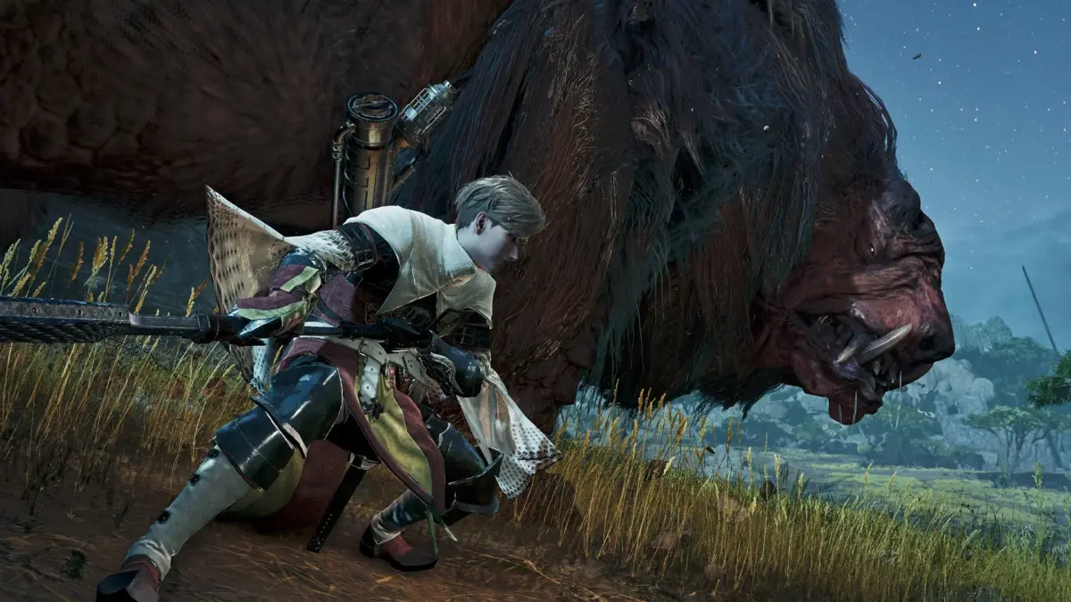 重厚な鎧をまとったキャラクターが巨大な獣型モンスターと対峙しているシーン