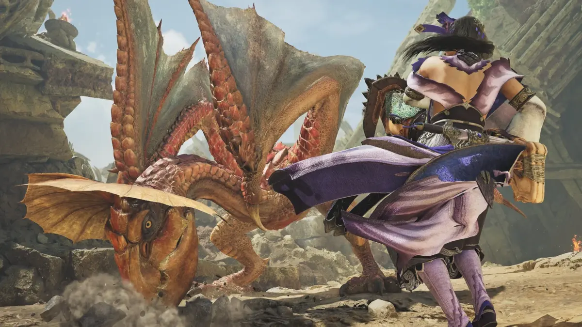 紫色の衣装をまとったキャラクターが、巨大な翼竜のようなモンスターと砂漠の遺跡で激しく戦闘している