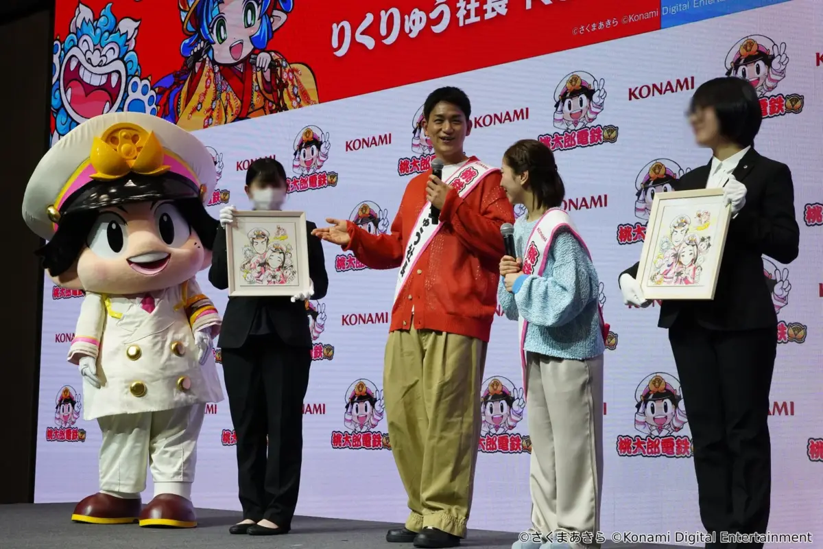 コラボ色紙を披露するりくりゅう社長