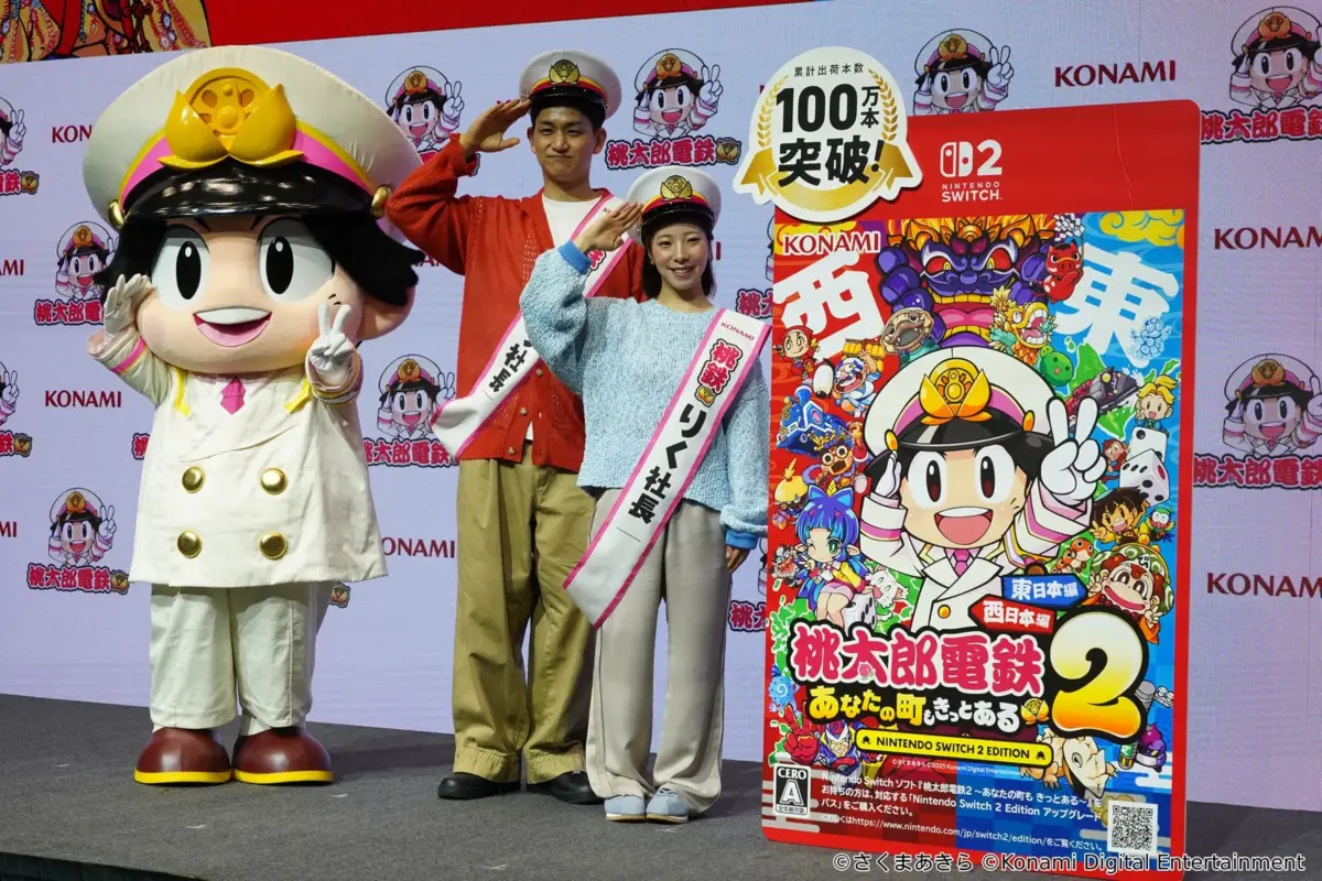 桃太郎とフォトセッションを行うりくりゅう社長