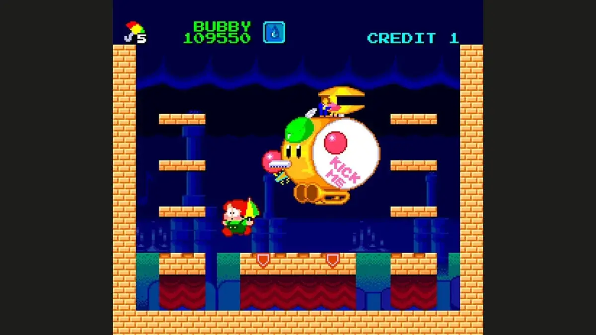 レトロなピクセルアートのアーケードゲーム画面で、主人公のバビーが傘を持って、眼のような巨大なボス敵と戦っています