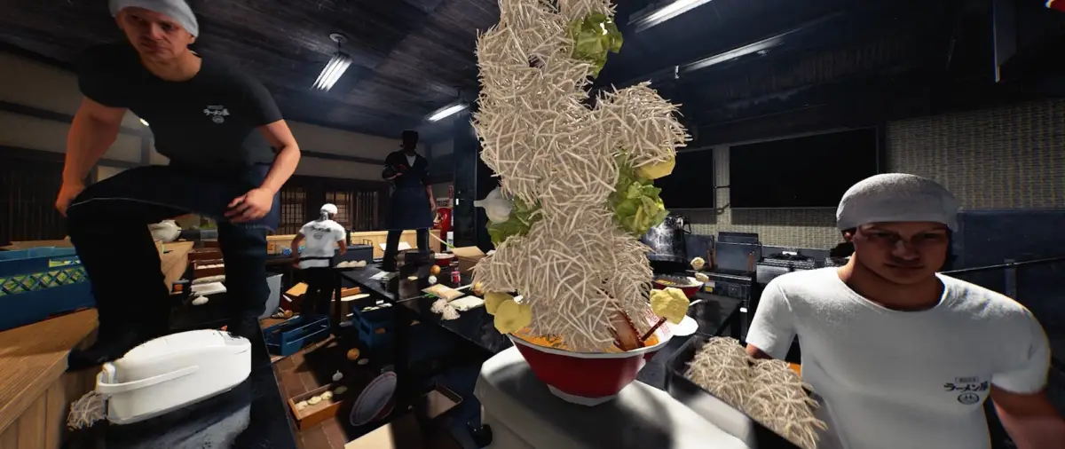 山盛りのラーメンを準備する料理人たち