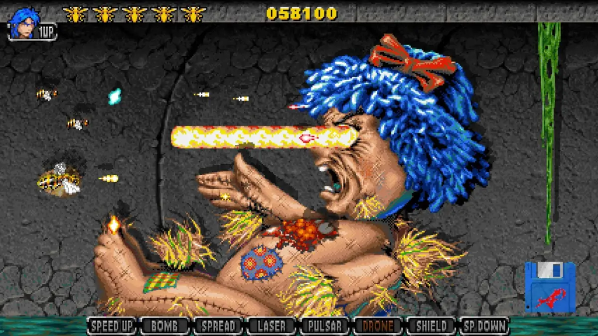 ピクセルアートで描かれた2Dシューティングゲームのボス戦のスクリーンショット。青い髪の巨大なボスが目から強力なレーザーを放ち、プレイヤー機が応戦している